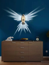 Eagle-shaped wall lamp by Home & Beyond Co featuring a metal eagle design mounted on a wall for decorative lighting.