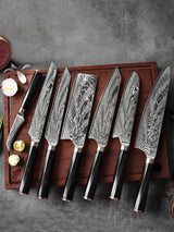 Home & Beyond Co Damascus steel chef's knife set with multiple knives displayed on a wooden cutting board.